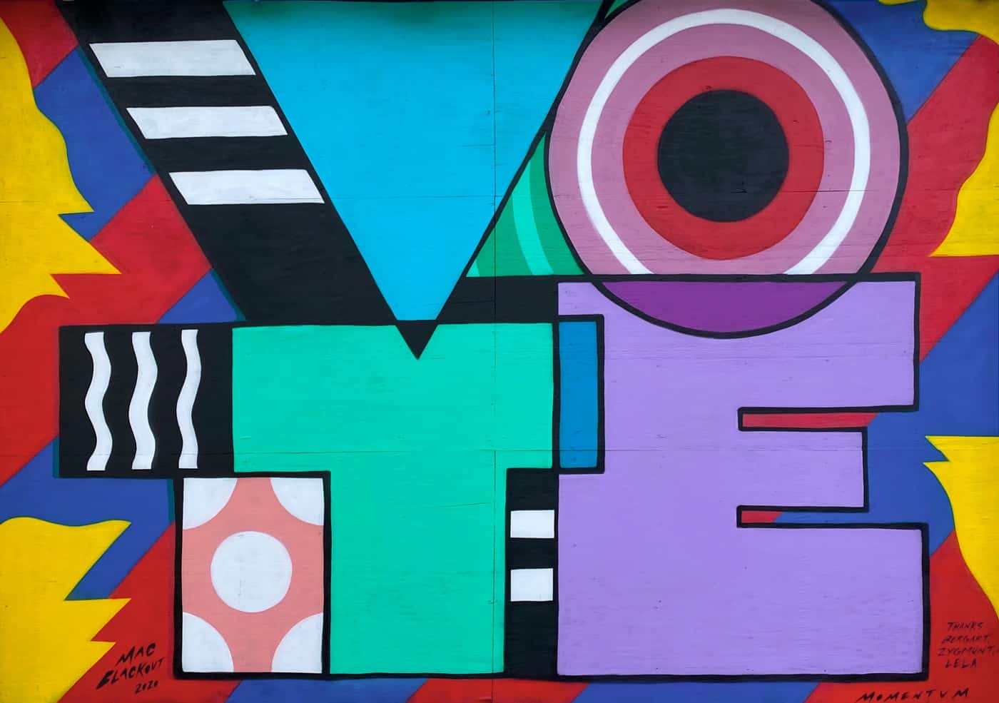 Painted mural reading 'VOTE'.