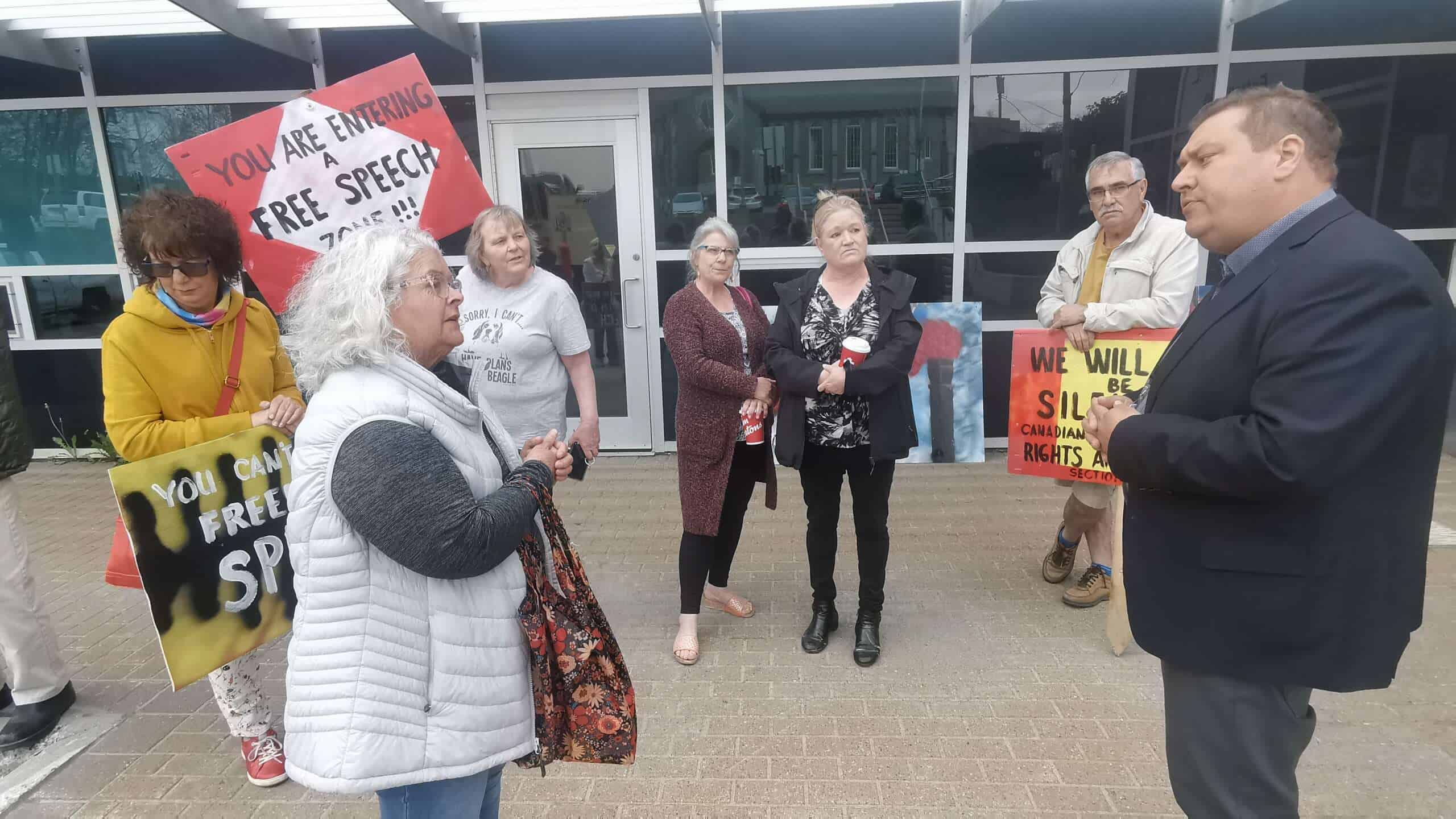 Anti-crematorium protestors carrying signs confront Corner Brook Mayor Jim Parsons at a May 30 rally in the city.