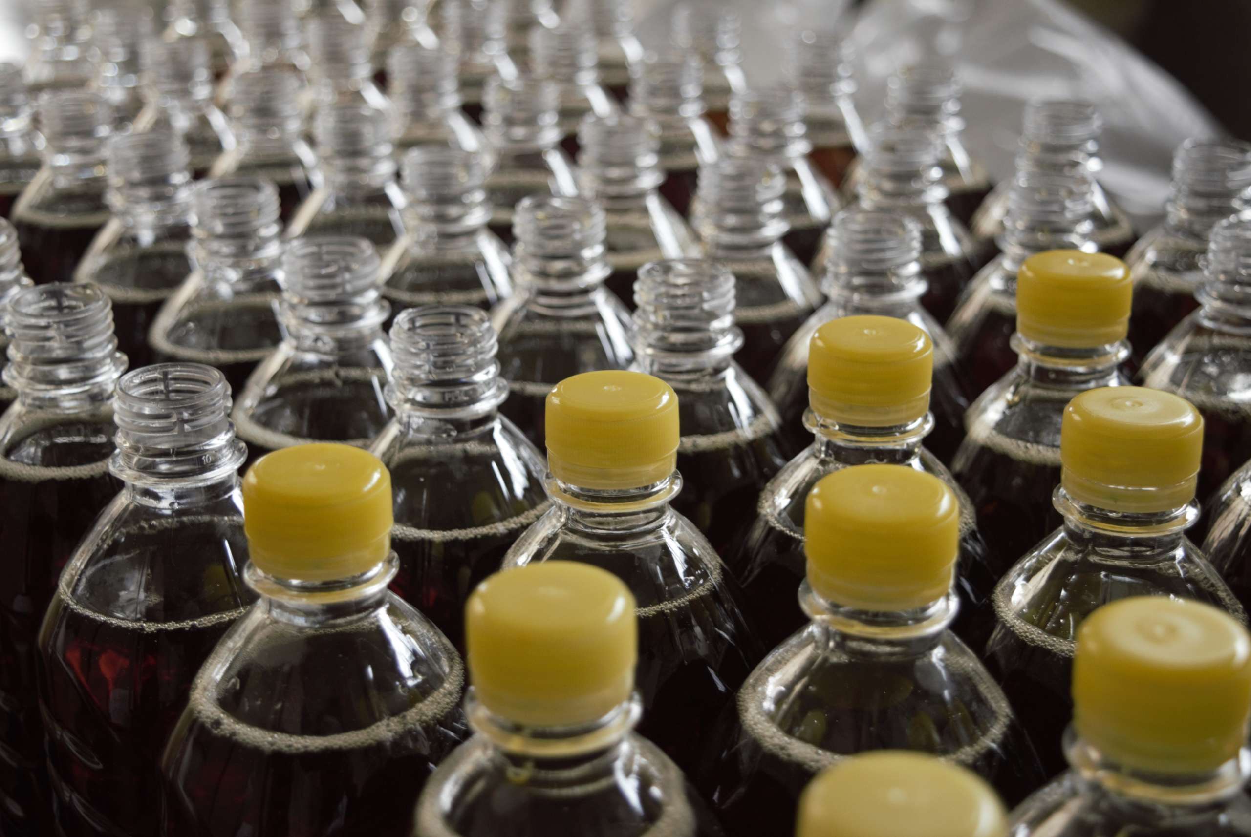 Bottled syrup in an assembly line.